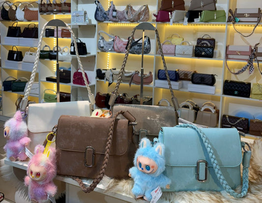 Chic Crossbody Bag with Braided Strap & Charm