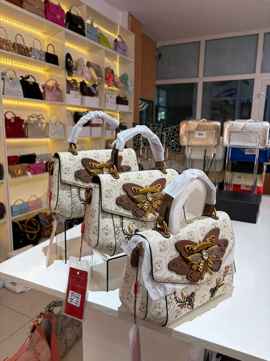 Luxury Monogram Bag with Butterfly Embellishment